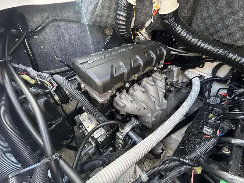 Slide: The Image of Engine compartment of a 2020 Yamaha Boats 242 Limited S, showcasing intricate wiring and components. - 11