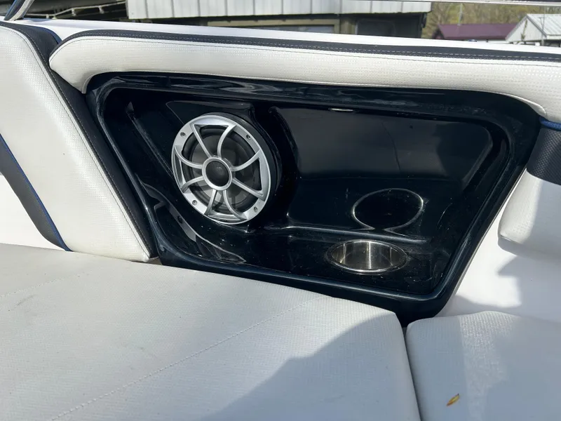 Slide: The Image of 2020 Yamaha Boats 242 Limited S interior with speaker and cup holder. - 13