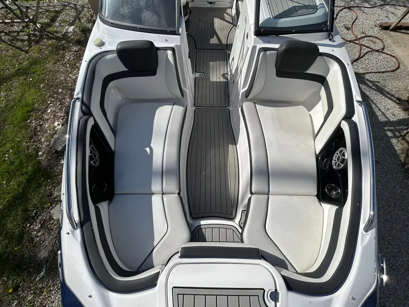 Slide: The Image of 2020 Yamaha Boats 242 Limited S interior with spacious seating and sleek design. - 17