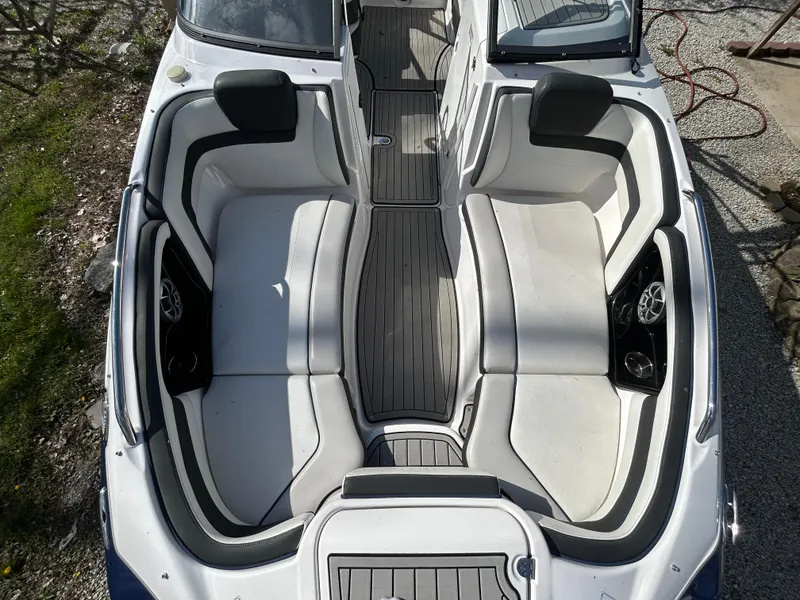 Slide: The Image of 2020 Yamaha Boats 242 Limited S interior with spacious seating and sleek design. - 18