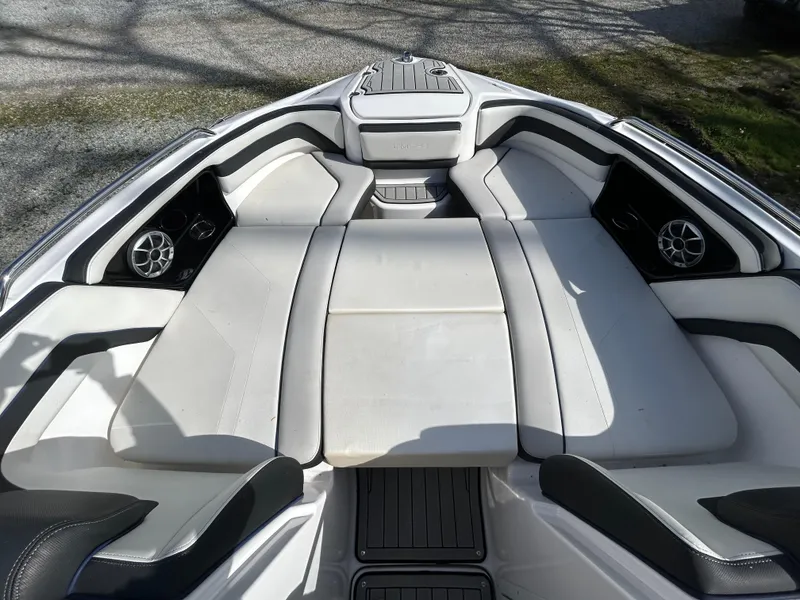 Slide: The Image of 2020 Yamaha Boats 242 Limited S interior with spacious seating and sleek design. - 19