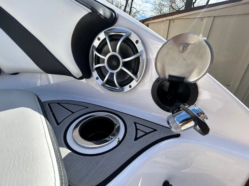 Slide: The Image of 2020 Yamaha Boats 242 Limited S interior with speaker and cup holder detail. - 25