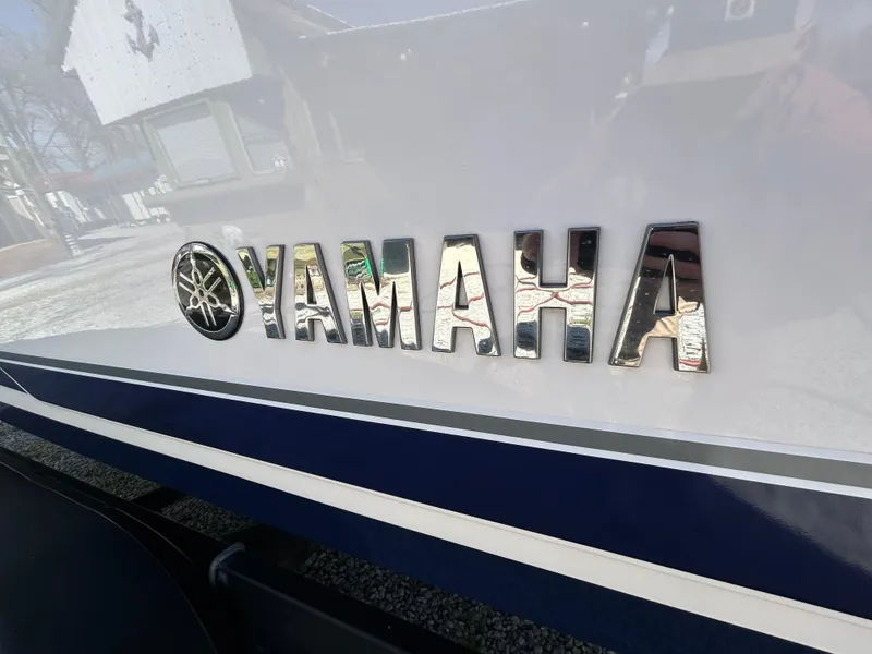 Slide: The Image of 2020 Yamaha Boats 242 Limited S logo on boat exterior. - 27