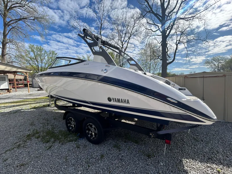 Slide: The Image of 2020 Yamaha Boats 242 Limited S on trailer, parked outdoors under a clear sky. - 4
