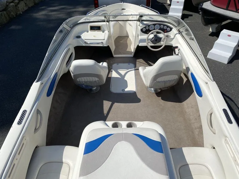 Slide: The Image of 2007 Stingray 195LR/LS/LX boat interior with white and blue seating, steering wheel, and dashboard. - 8