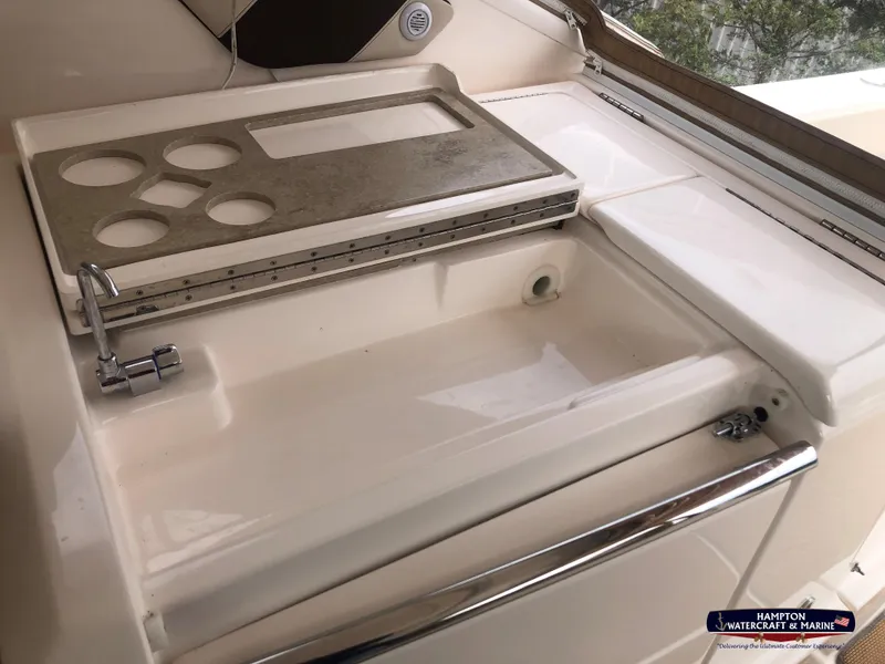 Slide: The Image of 2013 Tiara Yachts 3600 Coronet sink area with cutting board and cup holders. - 12