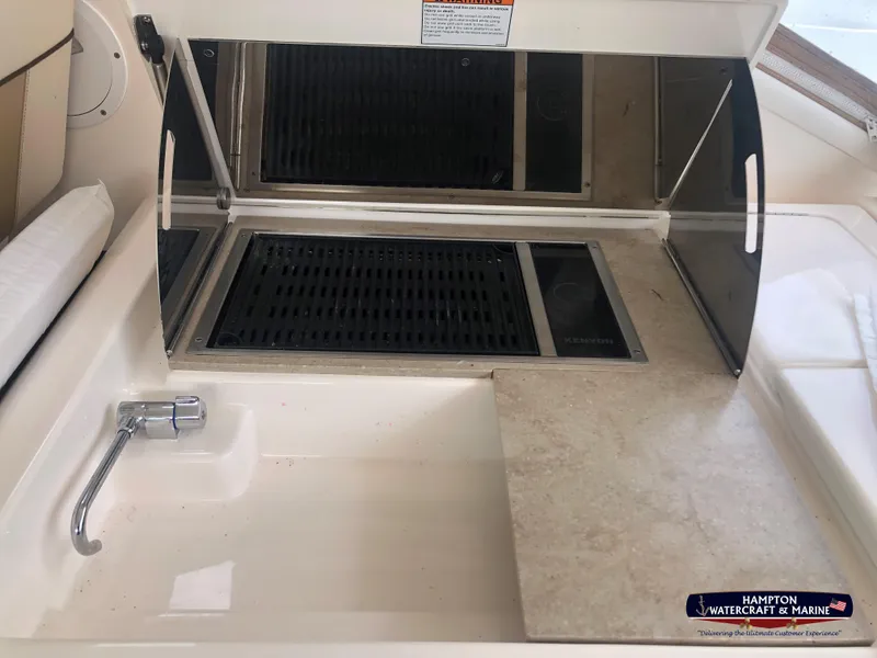 Slide: The Image of 2013 Tiara Yachts 3600 Coronet onboard grill and sink area. - 13