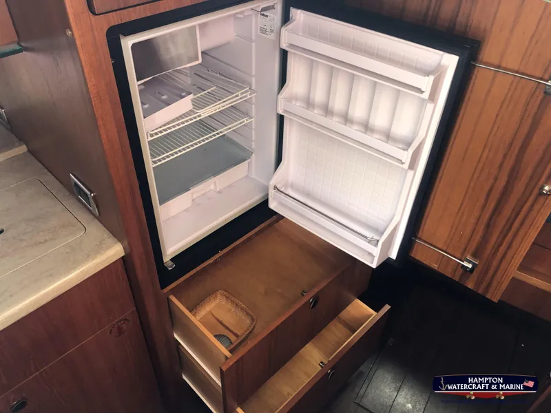 Slide: The Image of Open fridge and drawers in 2013 Tiara Yachts 3600 Coronet kitchen area. - 21