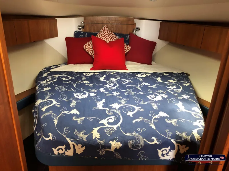 Slide: The Image of 2013 Tiara Yachts 3600 Coronet cabin with floral bedding and decorative pillows. - 24