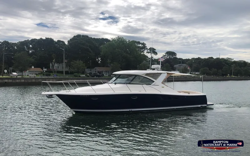Slide: The Image of 2013 Tiara Yachts 3600 Coronet cruising on a calm river under a cloudy sky. - 29