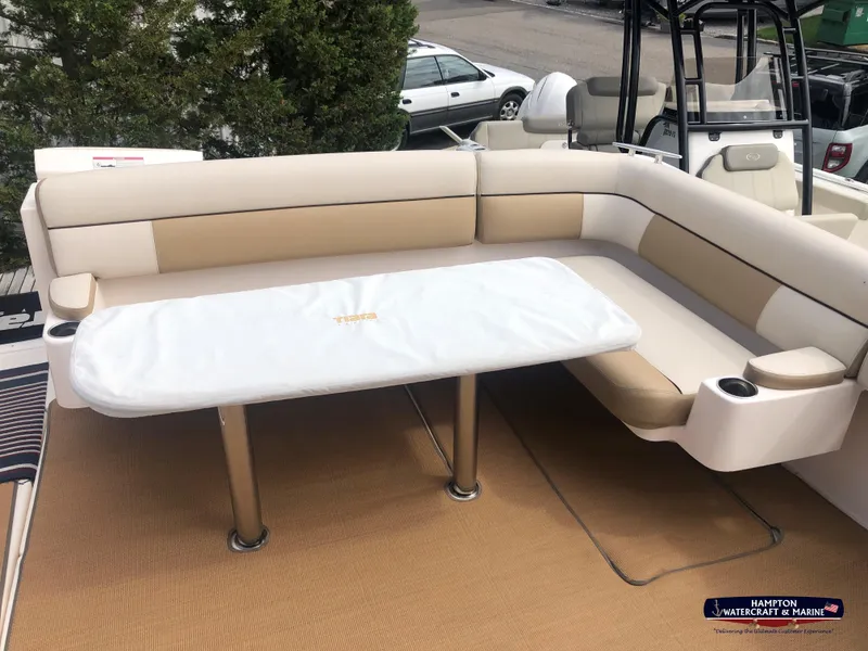 Slide: The Image of 2013 Tiara Yachts 3600 Coronet, beige seating area with table, outdoor setting. - 4
