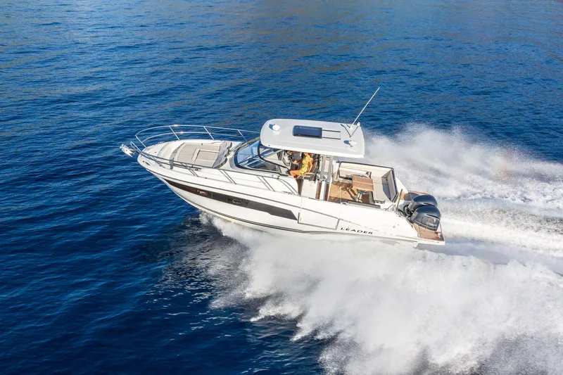 Slide: The Image of 2025 Jeanneau Leader 10.5 WA Series 2 cruising on open water. - 13