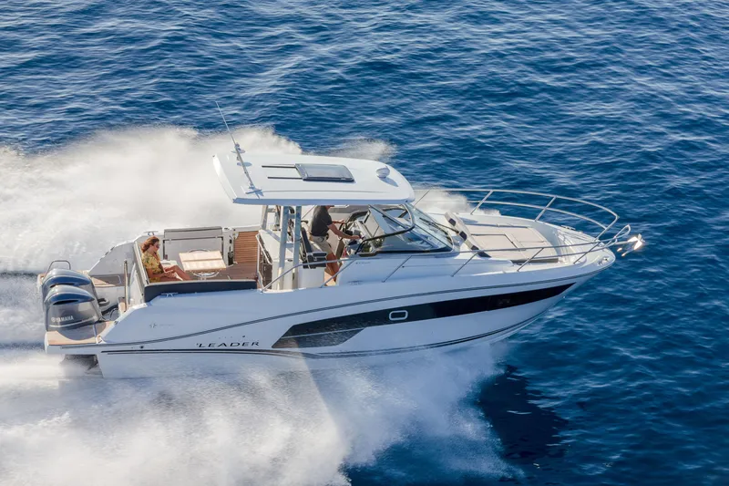 Slide: The Image of 2025 Jeanneau Leader 10.5 WA Series 2 cruising on open water. - 2