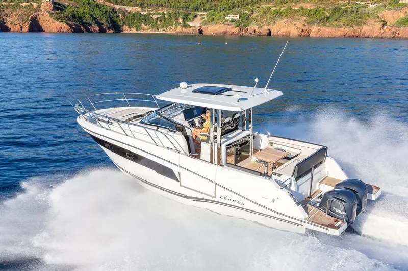 Slide: The Image of 2025 Jeanneau Leader 10.5 WA Series 2 cruising on open water, showcasing sleek design and powerful engines. - 3