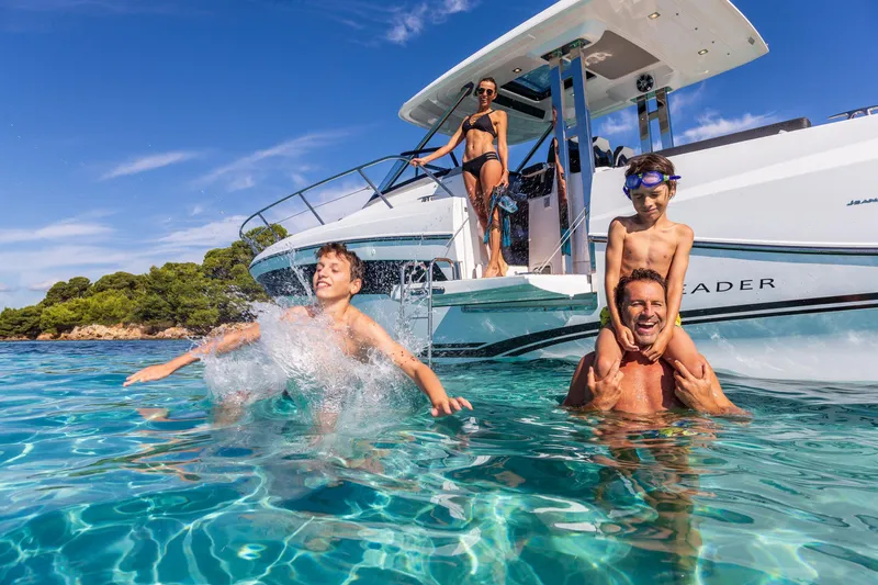 Slide: The Image of Family enjoying a day on the water with a 2025 Jeanneau Leader 10.5 WA Series 2 boat. - 6