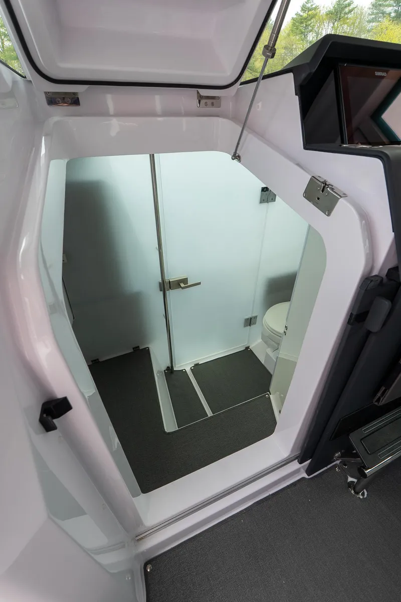 Slide: The Image of 2024 Axopar 37 Cross Cabin XC interior bathroom view. - 16