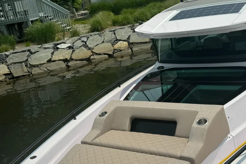 Slide: The Image of 2024 Axopar 37 Cross Cabin XC boat with sleek design and modern features. - 4