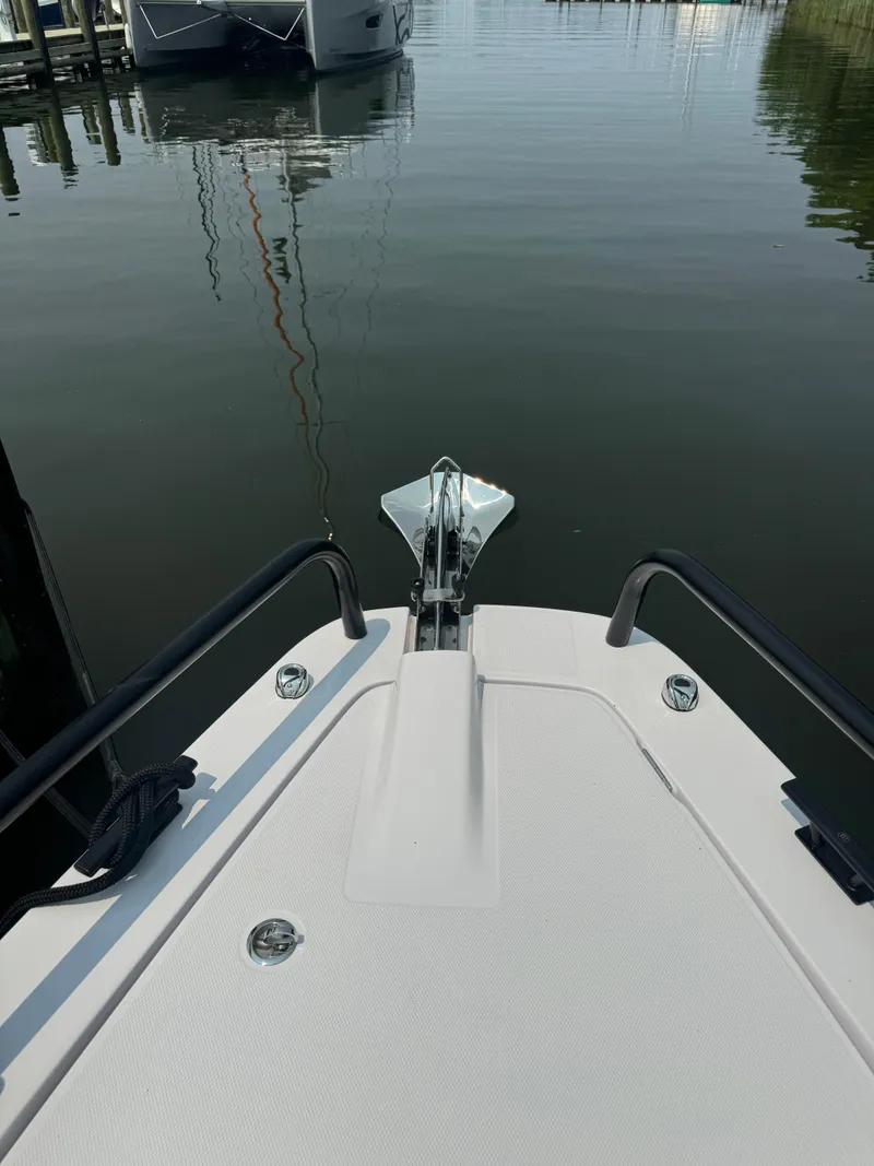 Slide: The Image of 2024 Axopar 37 Cross Cabin XC bow view at marina. - 7