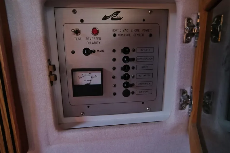 Slide: The Image of 1989 Sea Ray 268 Sun Dancer shore power control panel with reversed polarity indicator. - 10
