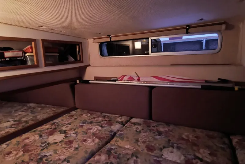 Slide: The Image of Interior cabin of 1989 Sea Ray 268 Sun Dancer with floral-patterned cushions. - 15