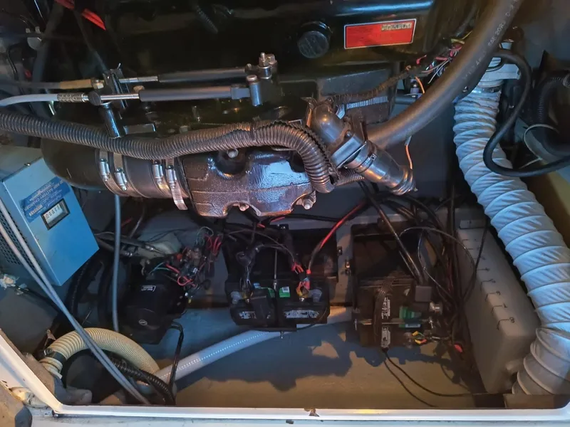 Slide: The Image of Engine compartment of a 1989 Sea Ray 268 Sun Dancer boat, showing mechanical components and wiring. - 3