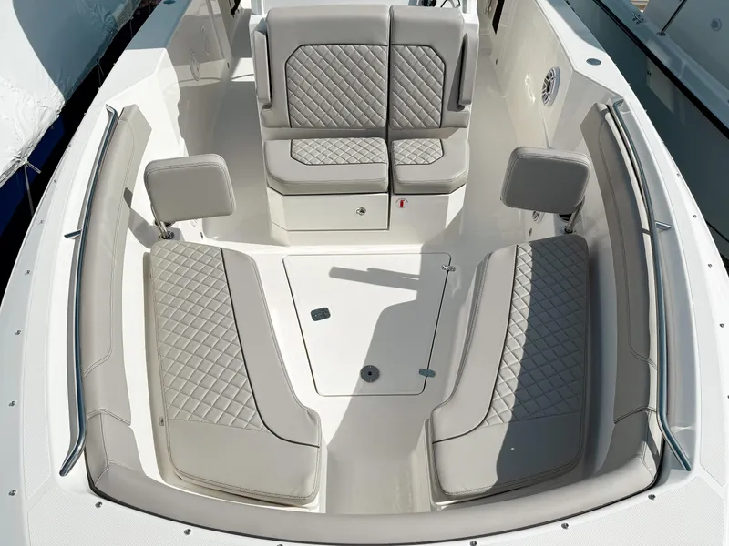 Slide: The Image of 2025 Pursuit S 288 Sport boat interior with cushioned seating and modern design. - 16