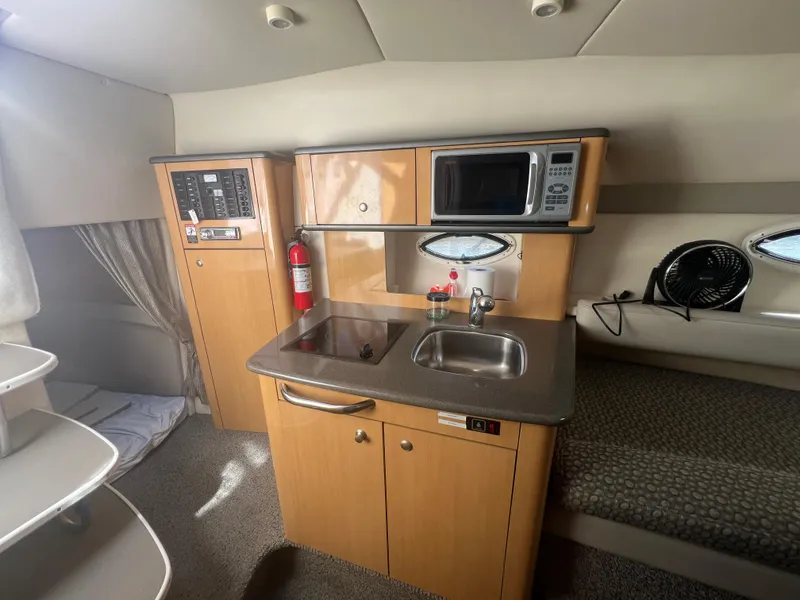 Slide: The Image of Galley area of 2004 Maxum 2700 SE yacht. - 13