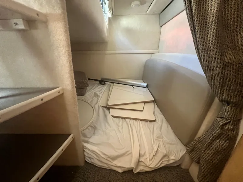 Slide: The Image of Interior of 2004 Maxum 2700 SE with sleeping area and storage. - 14