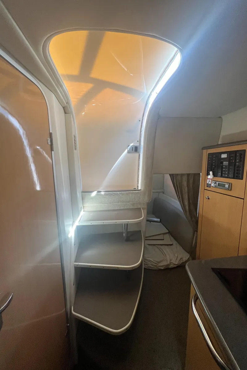 Slide: The Image of Interior of 2004 Maxum 2700 SE with stairs and cabin. - 18
