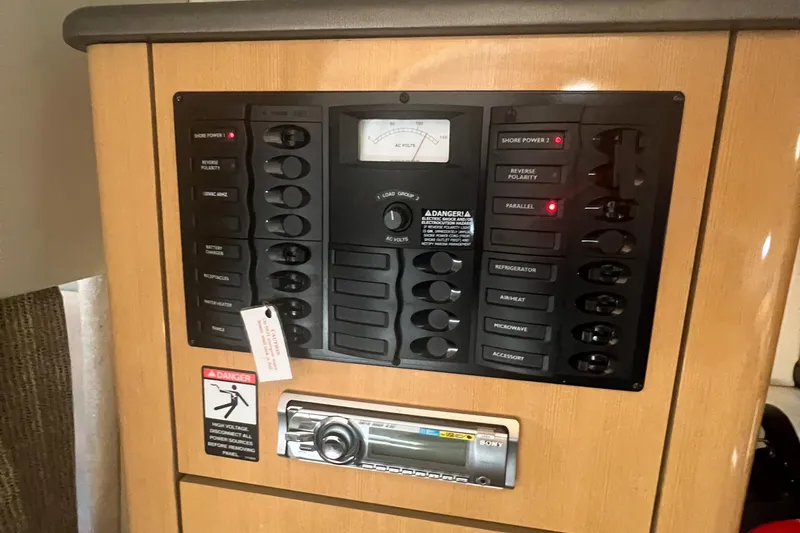 Slide: The Image of Electrical control panel of a 2004 Maxum 2700 SE boat. - 19