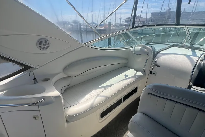 Slide: The Image of Interior of a 2004 Maxum 2700 SE boat with white leather seating. - 7