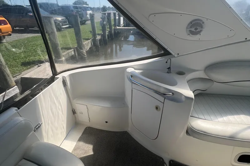 Slide: The Image of Interior of a 2004 Maxum 2700 SE boat with seating area. - 9