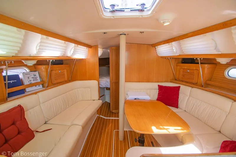 Slide: The Image of Interior of a 2006 Catalina 34' MKII sailboat with cozy seating and wooden finishes. - 13
