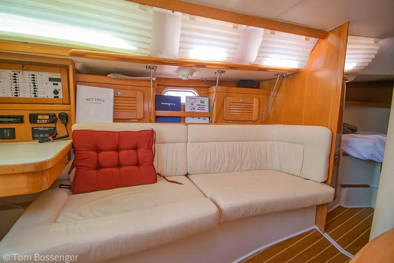 Slide: The Image of Interior of 2006 Catalina 34' MKII sailboat with cream seating and wooden accents. - 15
