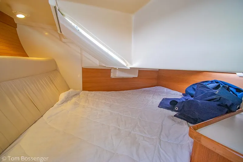 Slide: The Image of Interior cabin of a 2006 Catalina 34' MKII sailboat with cozy bedding. - 20