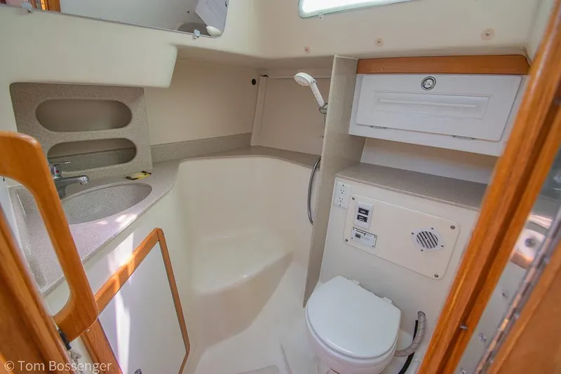 Slide: The Image of 2006 Catalina 34' MKII yacht bathroom with sink, toilet, and shower. - 21