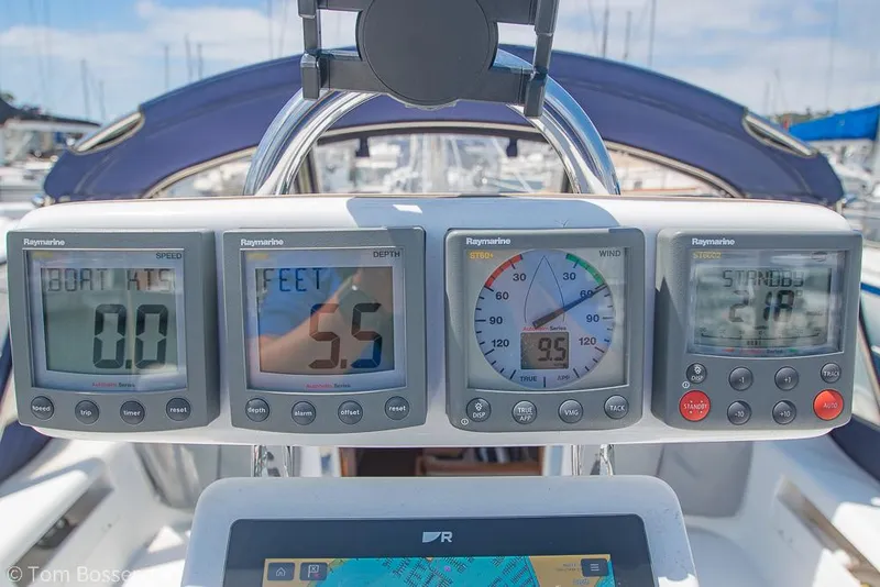 Slide: The Image of 2006 Catalina 34' MKII yacht dashboard with Raymarine instruments displaying navigation data. - 28
