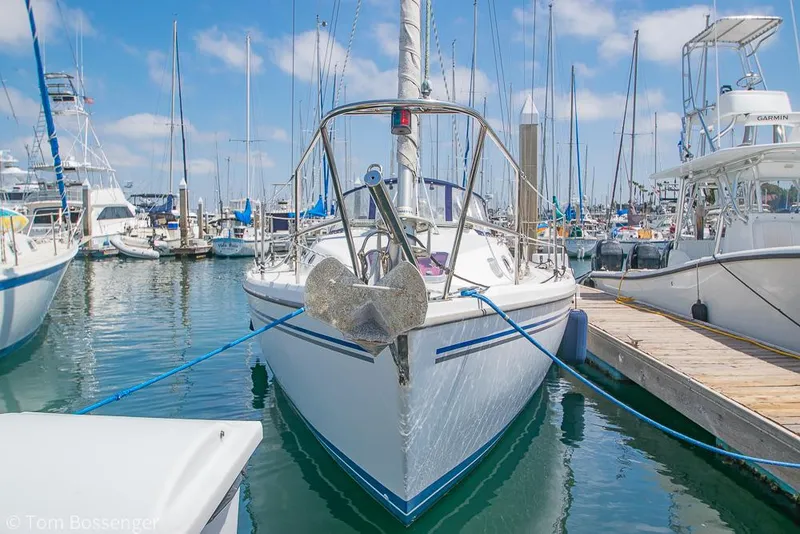 Slide: The Image of Catalina 34' MKII 2006 sailboat docked in a marina, surrounded by other boats. - 3