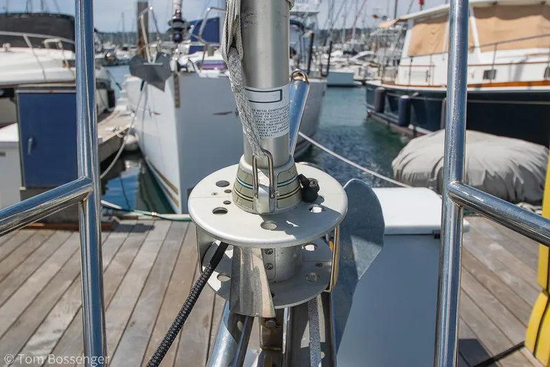 Slide: The Image of 2006 Catalina 34' MKII sailboat docked at a marina, showcasing deck and rigging details. - 34