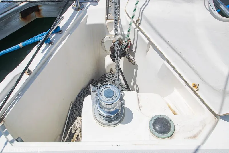 Slide: The Image of Anchor chain and winch on 2006 Catalina 34' MKII sailboat deck. - 35
