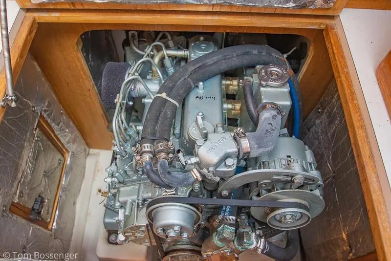 Slide: The Image of Engine compartment of a 2006 Catalina 34' MKII sailboat, showcasing mechanical components. - 39