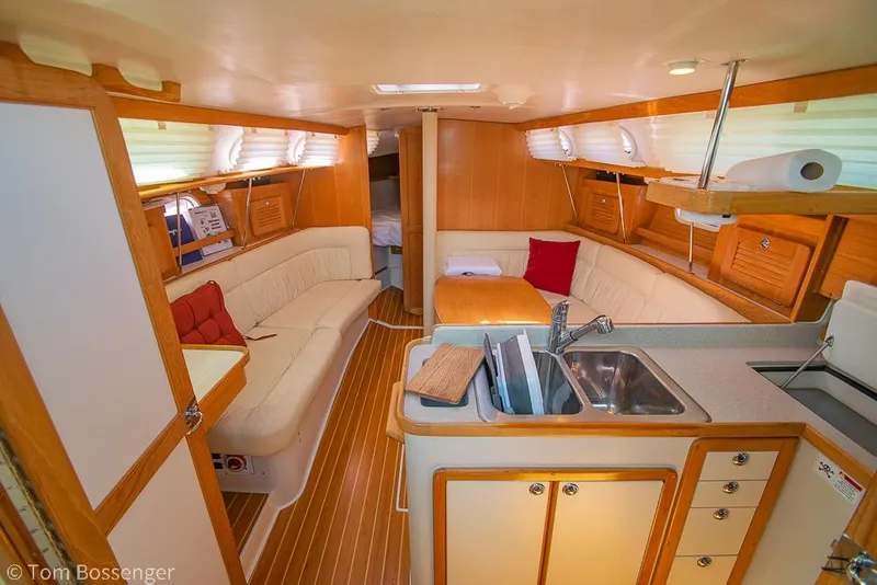 Slide: The Image of Interior of 2006 Catalina 34' MKII sailboat with cozy seating and kitchenette. - 7