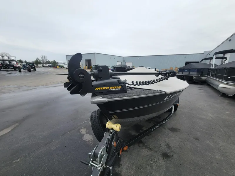 Slide: The Image of 2013 Lund 1650 Rebel XL Tiller boat with Minn Kota motor on trailer. - 4