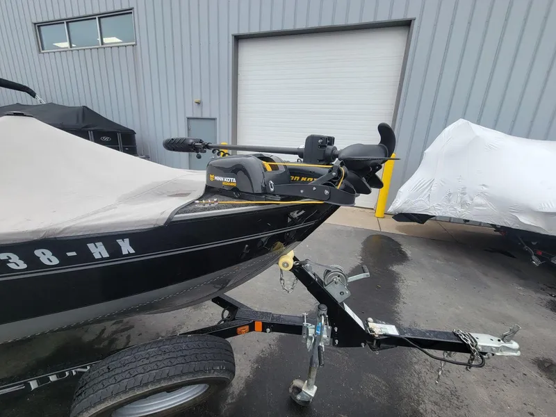 Slide: The Image of 2013 Lund 1650 Rebel XL Tiller boat with Minn Kota motor on trailer. - 6