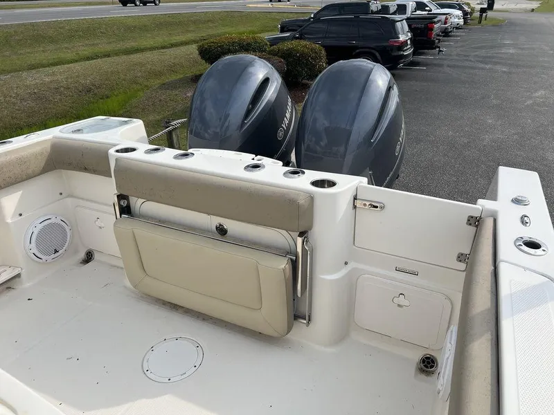 Slide: The Image of 2017 Sailfish 270 CC boat with dual outboard motors and spacious deck area. - 18