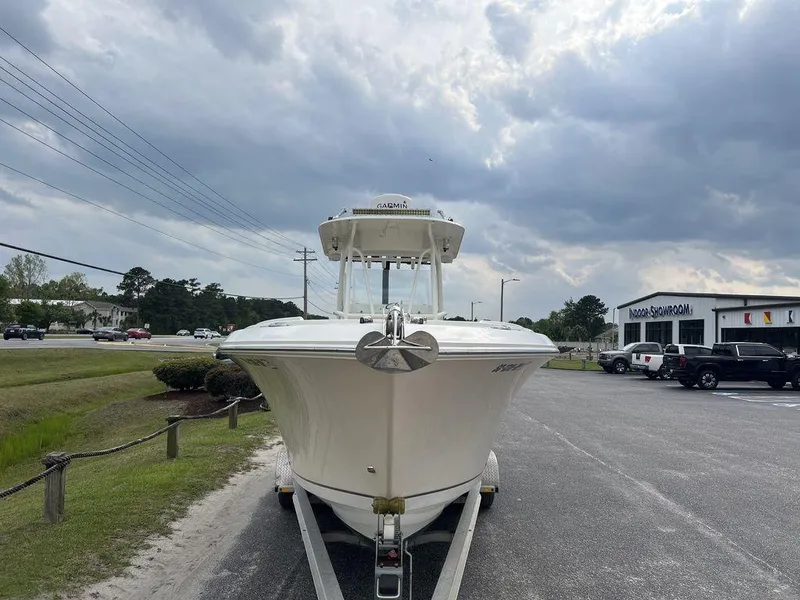 Slide: The Image of 2017 Sailfish 270 CC boat on trailer under cloudy sky. - 7