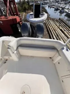 Slide: The Image of 2008 Century 2400 Walkaround boat interior with docked vessels in background. - 11