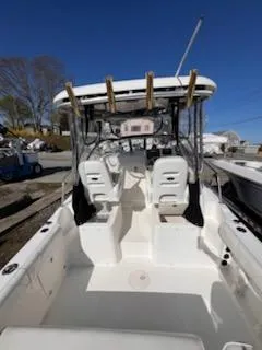Slide: The Image of 2008 Century 2400 Walkaround boat with dual seats and fishing rod holders. - 12