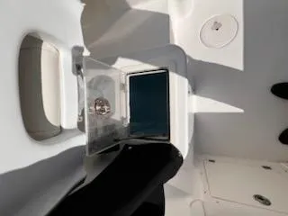 Slide: The Image of 2008 Century 2400 Walkaround boat interior with open storage compartment. - 15