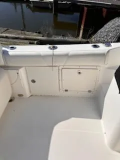 Slide: The Image of 2008 Century 2400 Walkaround boat interior, featuring storage compartments and seating area. - 17